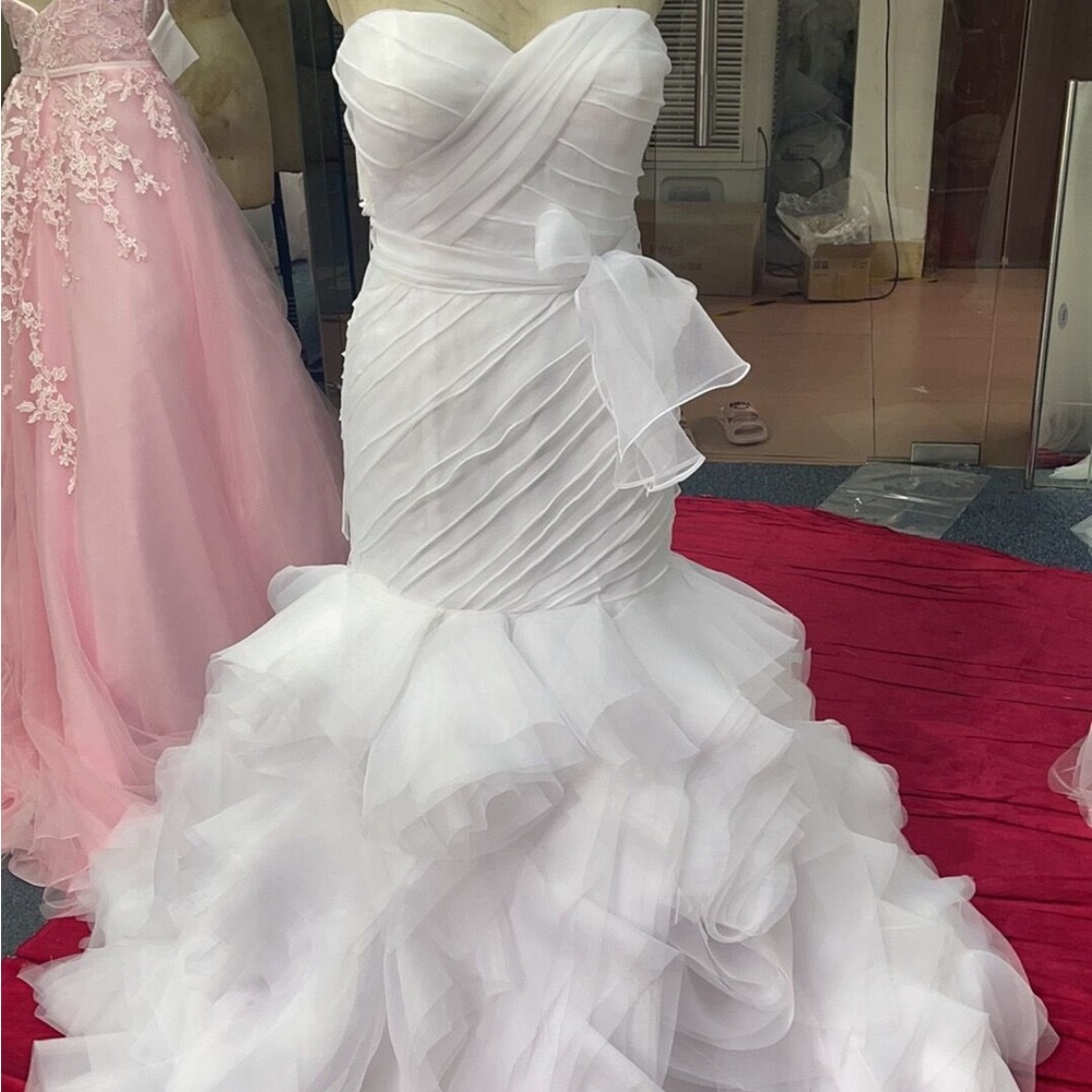 Custom wedding dress. Size 10-12 extra long train. Beautiful worn once